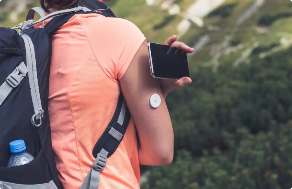 Woman checking blood sugar using device