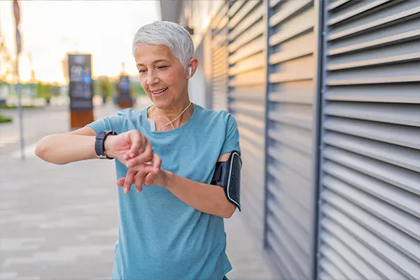 woman checking fitness watch